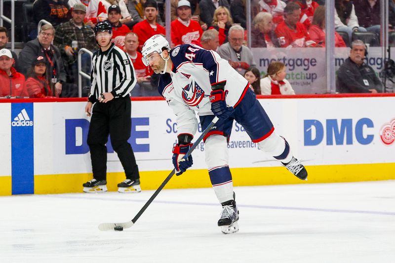 Mar 19, 2024; Detroit, Michigan, USA; Columbus Blue Jackets defenseman Erik Gudbranson (44) shoots the puck during the first period of the game against the Detroit Red Wings at Little Caesars Arena. Mandatory Credit: Brian Bradshaw Sevald-USA TODAY Sports