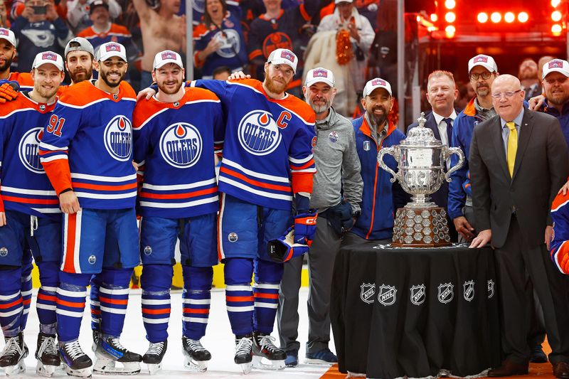 Jun 2, 2024; Edmonton, Alberta, CAN; The Edmonton Oilers pose with the Campbell Conference Bowl after winning the Western Conference Championship in game six of the Western Conference Final of the 2024 Stanley Cup Playoffs at Rogers Place. Mandatory Credit: Perry Nelson-USA TODAY Sports