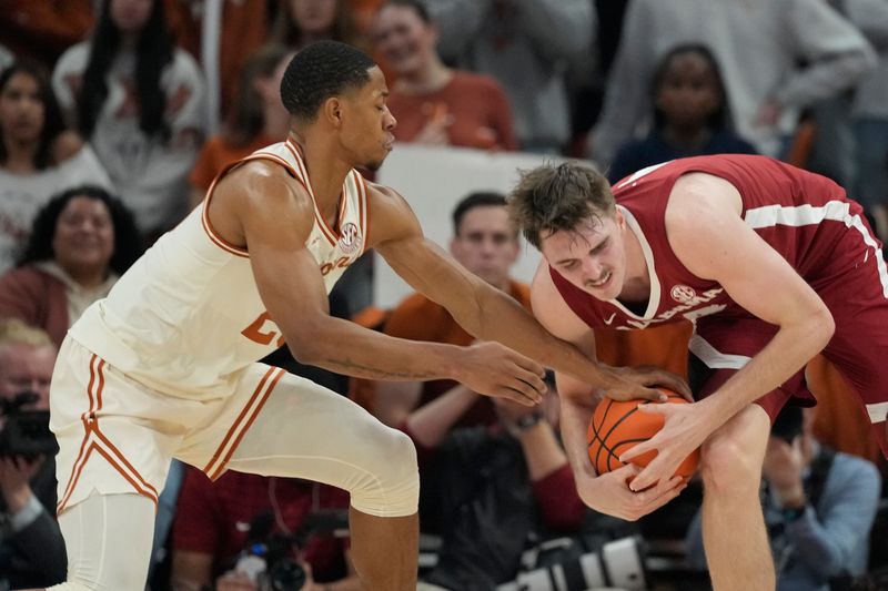 Feb 11, 2025; Austin, Texas, USA; Texas Longhorns 25t forward Jayson Kent (25) tries to take the ball away from Alabama Crimson Tide forward Grant Nelson (4) during the first half at Moody Center. Mandatory Credit: Scott Wachter-Imagn Images