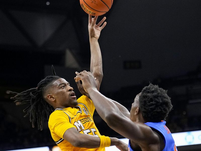 Jan 20, 2024; Columbia, Missouri, USA; Missouri Tigers guard Sean East II (55) shoots against Florida Gators forward Tyrese Samuel (4) during the first half at Mizzou Arena. Mandatory Credit: Jay Biggerstaff-USA TODAY Sports