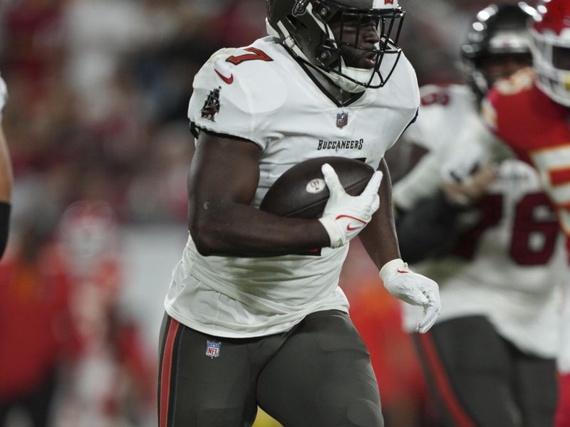 Tampa Bay Buccaneers running back Leonard Fournette (7) rushes with the ball during an NFL football game against the ,Kansas City Chiefs Sunday, October 2, 2022 in Tampa, FL. The Chiefs defeat the Buccaneers 41-31. (Peter Joneleit via AP)