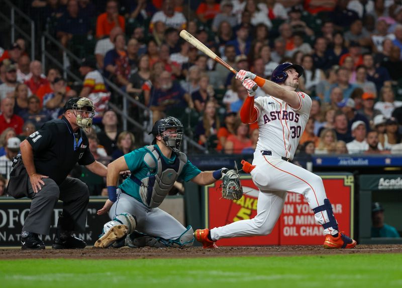 Sep 24, 2024; Houston, Texas, USA;  Houston Astros right fielder Kyle Tucker (30) hits a home run against the Seattle Mariners in the fourth inning at Minute Maid Park. Mandatory Credit: Thomas Shea-Imagn Images