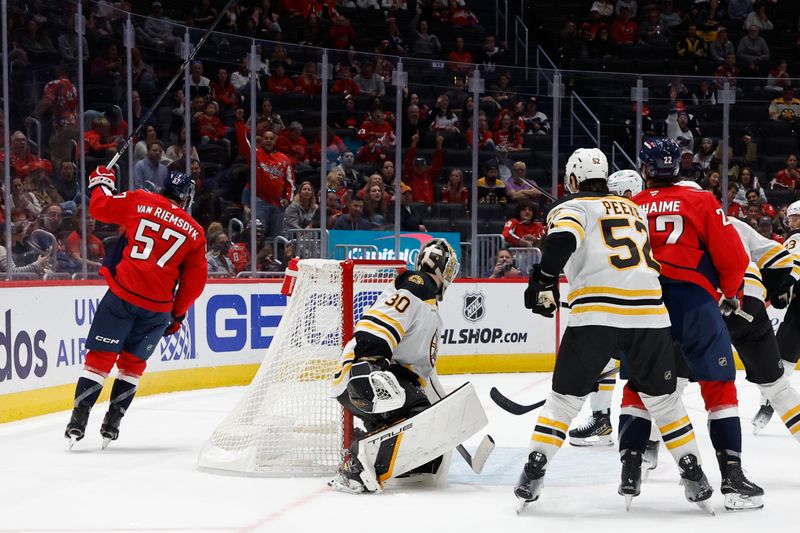 Oct 5, 2024; Washington, District of Columbia, USA; Washington Capitals defenseman Trevor van Riemsdyk (57) celebrates after scoring a goal on Boston Bruins goaltender Brandon Bussi (30) in the third period at Capital One Arena. Mandatory Credit: Geoff Burke-Imagn Images