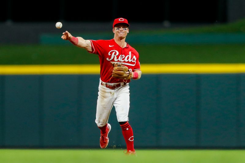 Aug 19, 2023; Cincinnati, Ohio, USA; Cincinnati Reds second baseman Matt McLain (9) throws to first to get the out in the eighth inning at Great American Ball Park. Mandatory Credit: Katie Stratman-USA TODAY Sports