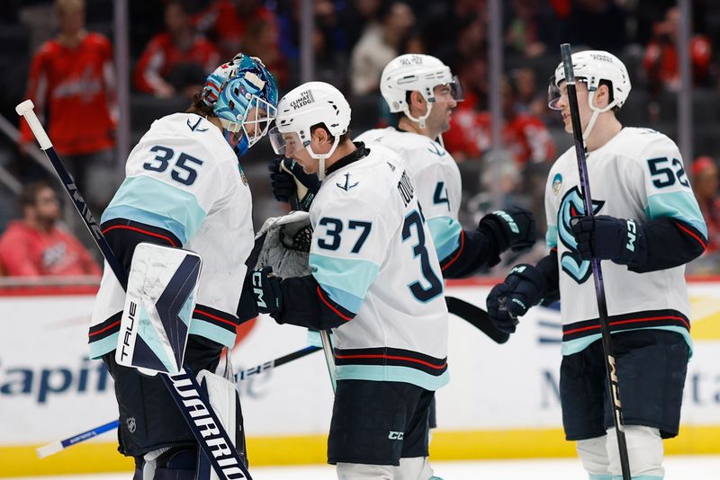 Jan 11, 2024; Washington, District of Columbia, USA; Seattle Kraken goaltender Joey Daccord (35) celebrates with teammates after their game against the Washington Capitals at Capital One Arena. Mandatory Credit: Geoff Burke-USA TODAY Sports