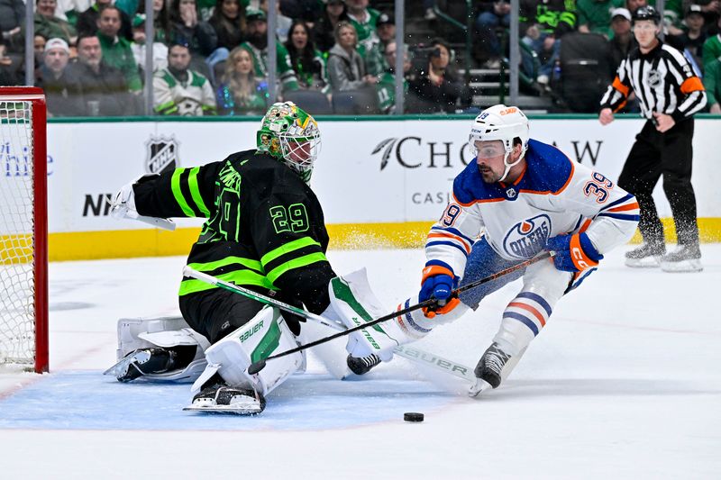 Apr 3, 2024; Dallas, Texas, USA; Dallas Stars goaltender Jake Oettinger (29) stops a breakaway shot by Edmonton Oilers center Sam Carrick (39) during the first period at the American Airlines Center. Mandatory Credit: Jerome Miron-USA TODAY Sports