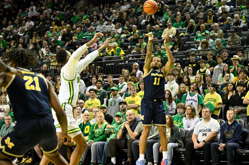 Jan 17, 2026; Eugene, Oregon, USA; Michigan Wolverines guard Roddy Gayle Jr. (11) shoots the ball during the second half at Matthew Knight Arena. Mandatory Credit: Craig Strobeck-Imagn Images