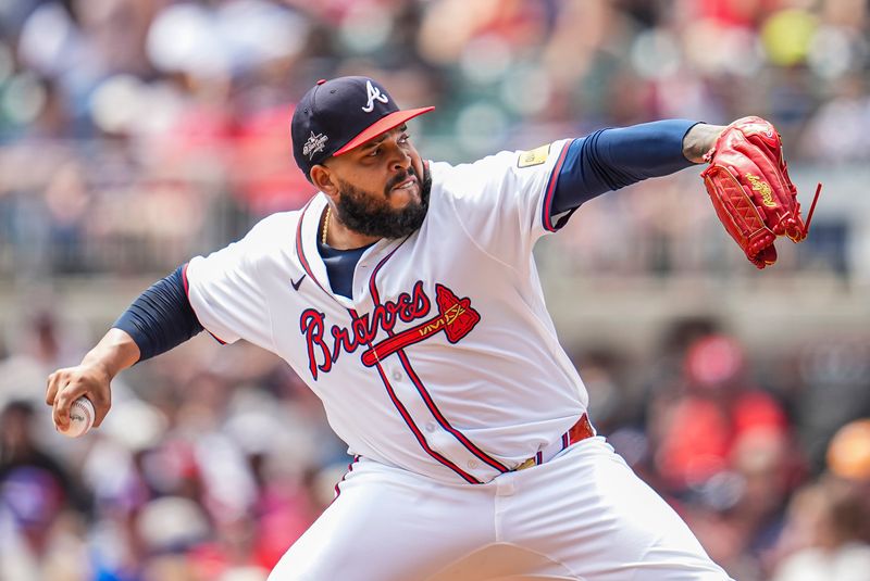 Apr 23, 2025; Cumberland, Georgia, USA; Atlanta Braves pitcher Daysbel Hernández (62) pitches against the St. Louis Cardinals during the eighth inning at Truist Park. Mandatory Credit: Dale Zanine-Imagn Images