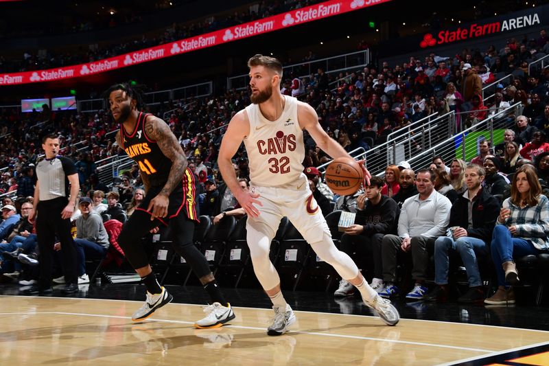 ATLANTA, GA - JANUARY 20: Dean Wade #32 of the Cleveland Cavaliers dribbles the ball during the game against the Atlanta Hawks on January 20, 2024 at State Farm Arena in Atlanta, Georgia.  NOTE TO USER: User expressly acknowledges and agrees that, by downloading and/or using this Photograph, user is consenting to the terms and conditions of the Getty Images License Agreement. Mandatory Copyright Notice: Copyright 2024 NBAE (Photo by Scott Cunningham/NBAE via Getty Images)