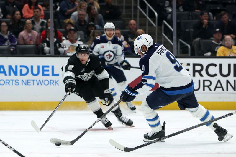Nov 4, 2025; Los Angeles, California, USA;  Winnipeg Jets left wing Alex Iafallo (9) skates with the puck during the third period against the Los Angeles Kings at Crypto.com Arena. Mandatory Credit: Kiyoshi Mio-Imagn Images