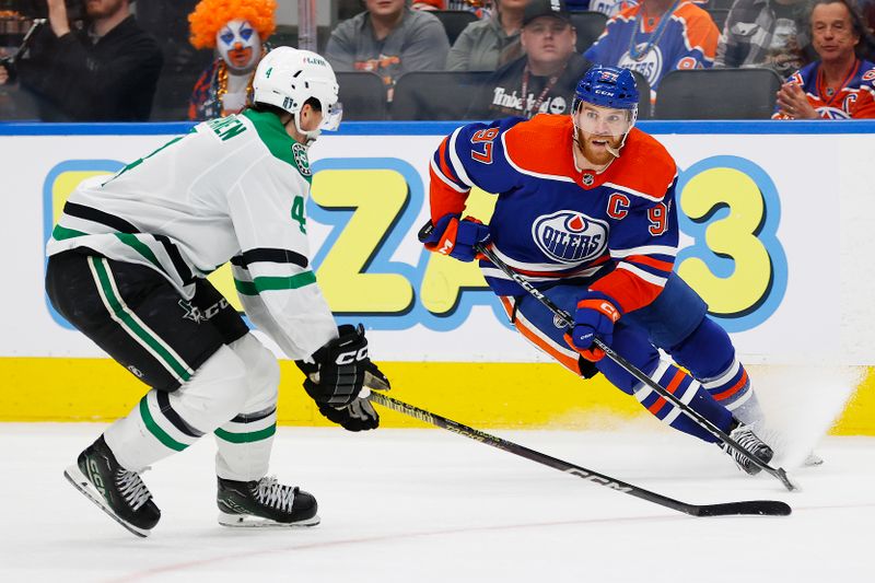 May 29, 2024; Edmonton, Alberta, CAN; Edmonton Oilers forward Connor McDavid (97) makes a move on Dallas Stars defensemen Miro Heiskanen (4) during the third period in game four of the Western Conference Final of the 2024 Stanley Cup Playoffs at Rogers Place. Mandatory Credit: Perry Nelson-USA TODAY Sports