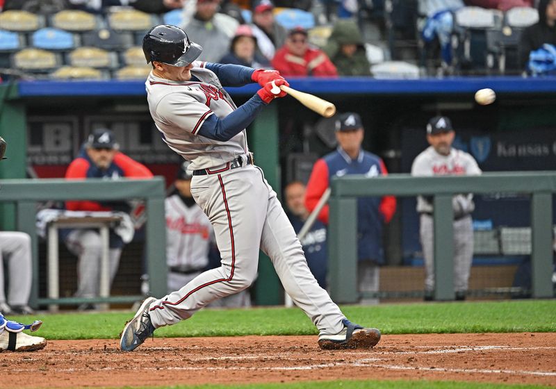 Apr 15, 2023; Kansas City, Missouri, USA;  Atlanta Braves catcher Sean Murphy (12) hits a two RBI double during the third inning against the Kansas City Royals at Kauffman Stadium. Mandatory Credit: Peter Aiken-USA TODAY Sports