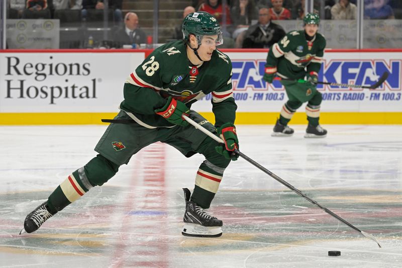 Sep 29, 2024; Saint Paul, Minnesota, USA;  Minnesota Wild forward Liam Ohgren (28) skates with the puck during the third period at Xcel Energy Center. Mandatory Credit: Nick Wosika-Imagn Images