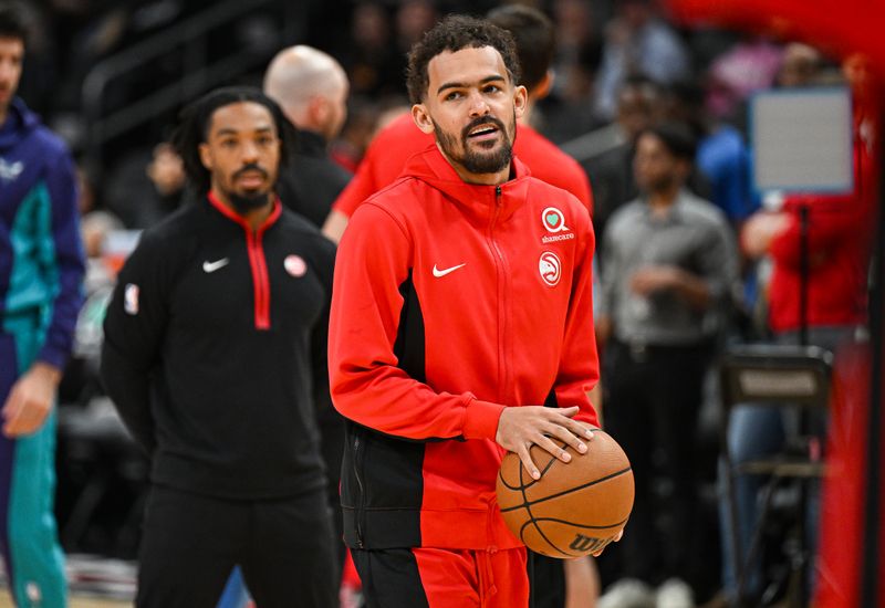 ATLANTA, GEORGIA - APRIL 10: Trae Young #11 of the Atlanta Hawks warms up before the game against the Charlotte Hornets at State Farm Arena on April 10, 2024 in Atlanta, Georgia. NOTE TO USER: User expressly acknowledges and agrees that, by downloading and/or using this photograph, user is consenting to the terms and conditions of the Getty Images License Agreement. (Photo by Paras Griffin/Getty Images)