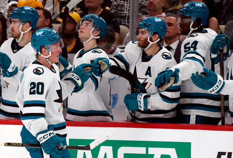 Mar 14, 2024; Pittsburgh, Pennsylvania, USA; San Jose Sharks left wing Fabian Zetterlund (20) celebrates with the Sharks bench after scoring a goal against the Pittsburgh Penguins during the first period at PPG Paints Arena. Mandatory Credit: Charles LeClaire-USA TODAY Sports