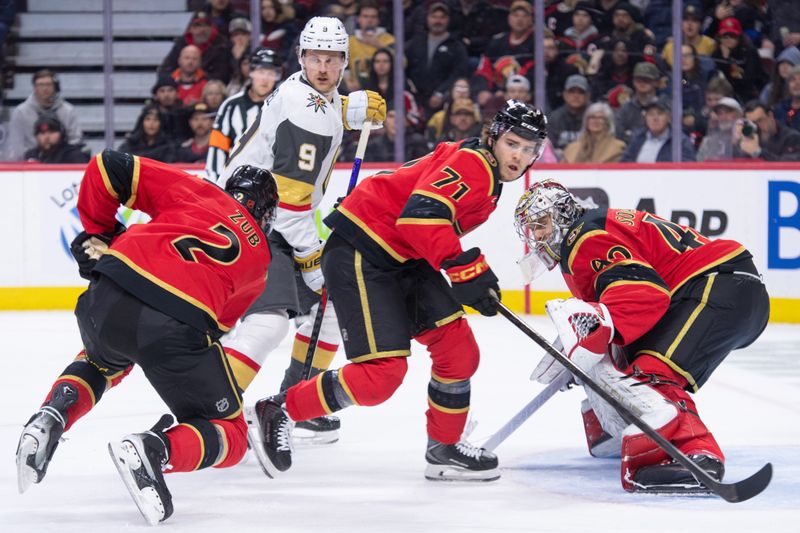 Jan 25, 2026; Ottawa, Ontario, CAN; Ottawa Senators defensmenan Artem Zub (2) and center Ridly Greig (71) provide coverage in front of goalie Mads Sogaard (40) in the second period against the Vegas Golden Knights at the Canadian Tire Centre. Mandatory Credit: Marc DesRosiers-IMAGN Images