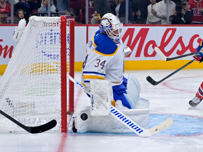 Oct 20, 2025; Montreal, Quebec, CAN; Buffalo Sabres goalie Alex Lyon (34) makes a save against the Montreal Canadiens during the third period at the Bell Centre. Mandatory Credit: Eric Bolte-Imagn Images