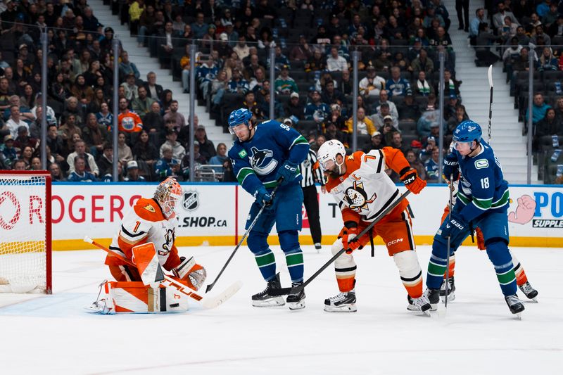 Mar 24, 2026; Vancouver, British Columbia, CAN; Vancouver Canucks forward Linus Karlsson (94) and forward Drew O'Connor (18) and Anaheim Ducks defenseman Radko Gudas (7) watch goalie Lukas Dostal (1) makes a save in the second period at Rogers Arena. Mandatory Credit: Bob Frid-Imagn Images