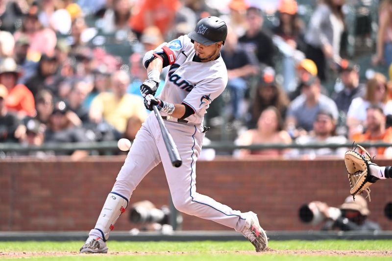 May 21, 2023; San Francisco, California, USA; Miami Marlins infielder Luis Arraez (3) bats against the San Francisco Giants during the eighth inning at Oracle Park. Mandatory Credit: Robert Edwards-USA TODAY Sports