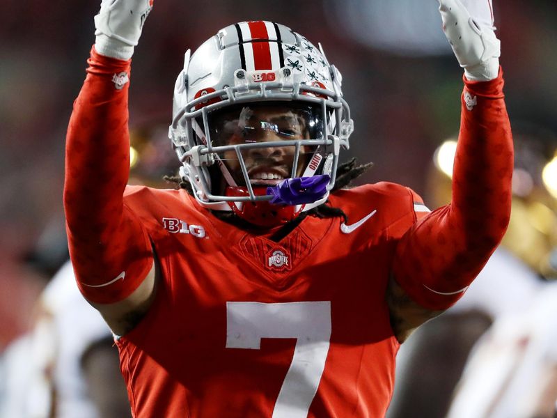 Nov 18, 2023; Columbus, Ohio, USA; Ohio State Buckeyes cornerback Jordan Hancock (7) celebrates the interception during the second half against the Minnesota Golden Gophers at Ohio Stadium. Mandatory Credit: Joseph Maiorana-USA TODAY Sports