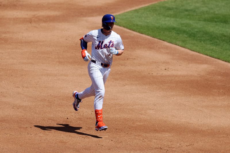Apr 23, 2025; New York City, New York, USA; New York Mets second baseman Brett Baty (7) rounds the bases after hitting a two run home run against the Philadelphia Phillies during the second inning at Citi Field. Mandatory Credit: Brad Penner-Imagn Images