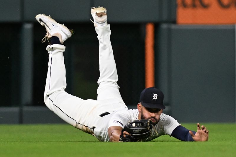 Sep 25, 2024; Detroit, Michigan, USA;  Detroit Tigers left fielder Riley Greene (31) makes a diving catch against the Tampa Bay Rays for the last out of the eighth inning at Comerica Park. Mandatory Credit: Lon Horwedel-Imagn Images