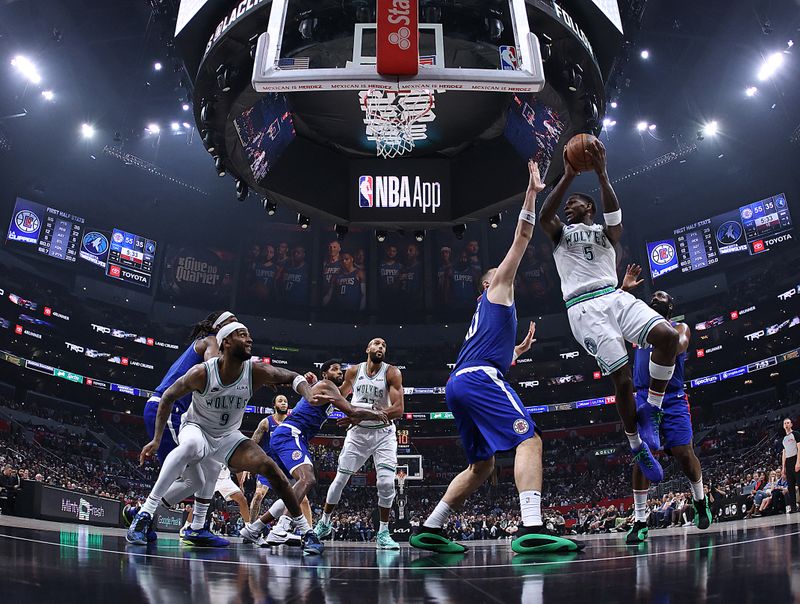 LOS ANGELES, CALIFORNIA - MARCH 12: Anthony Edwards #5 of the Minnesota Timberwolves attempts a shot in front of Ivica Zubac #40 of the LA Clippers during a 118-100 Timberwolves win  at Crypto.com Arena on March 12, 2024 in Los Angeles, California. (Photo by Harry How/Getty Images)