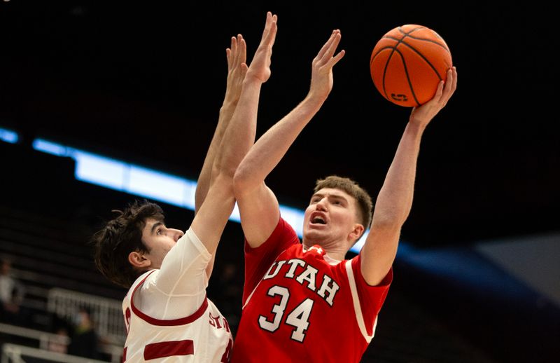 Jan 14, 2024; Stanford, California, USA; Utah Utes center Lawson Lovering (34) shoots over Stanford Cardinal forward Maxime Raynaud (42) during the first half at Maples Pavilion. Mandatory Credit: D. Ross Cameron-USA TODAY Sports