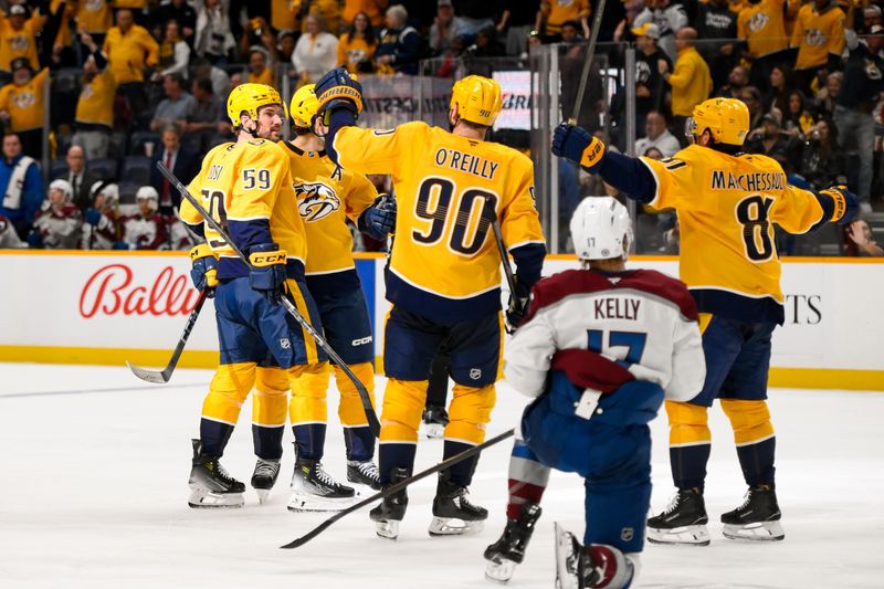 Nashville Predators defenseman Roman Josi (59) celebrates his goal with his teammates  against the Colorado Avalanche Nov 2, 2024; Nashville, Tennessee, USA;  during the third period at Bridgestone Arena. Mandatory Credit: Steve Roberts-Imagn Images