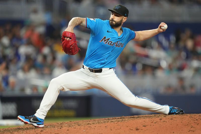 Jun 23, 2024; Miami, Florida, USA;  Miami Marlins pitcher Tanner Scott (66) pitches against the Seattle Mariners in the ninth inning at loanDepot Park. Mandatory Credit: Jim Rassol-USA TODAY Sports