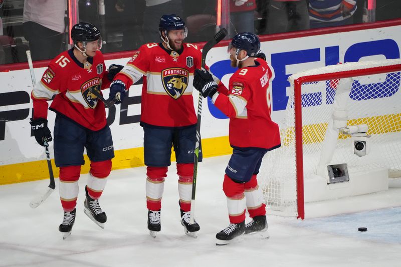 Jun 24, 2024; Sunrise, Florida, USA; Florida Panthers forward Carter Verhaeghe (23) celebrates scoring with forward Anton Lundell (15) and forward Sam Bennett (9) against Edmonton Oilers goaltender Skinner Stuart (74) during the first period in game seven of the 2024 Stanley Cup Final at Amerant Bank Arena. Mandatory Credit: Jim Rassol-USA TODAY Sports