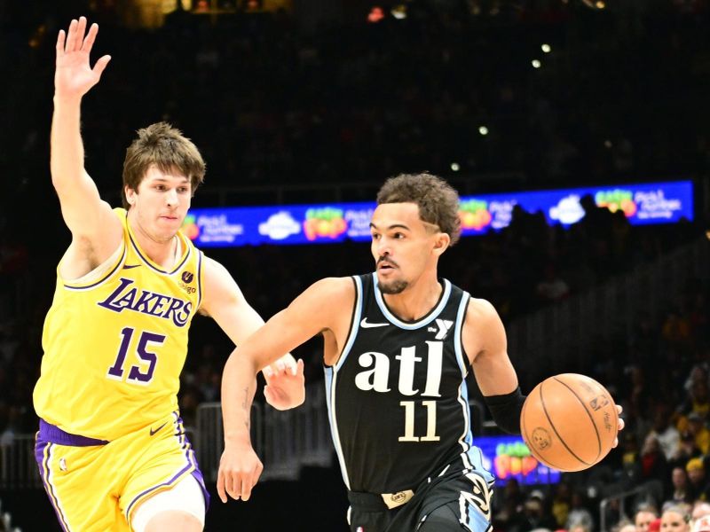 ATLANTA, GA - JANUARY 30: Trae Young #11 of the Atlanta Hawks handles the ball during the game  against the Los Angeles Lakers on January 30, 2024 at State Farm Arena in Atlanta, Georgia.  NOTE TO USER: User expressly acknowledges and agrees that, by downloading and/or using this Photograph, user is consenting to the terms and conditions of the Getty Images License Agreement. Mandatory Copyright Notice: Copyright 2024 NBAE (Photo by Adam Hagy/NBAE via Getty Images)