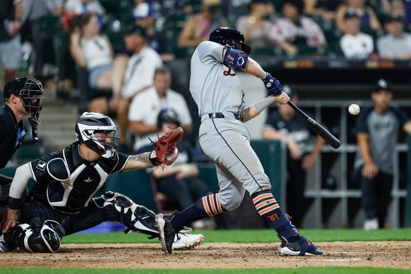 Aug 26, 2024; Chicago, Illinois, USA; Detroit Tigers second baseman Jace Jung (17) hits an RBI-single against the Chicago White Sox during the seventh inning at Guaranteed Rate Field. Mandatory Credit: Kamil Krzaczynski-USA TODAY Sports