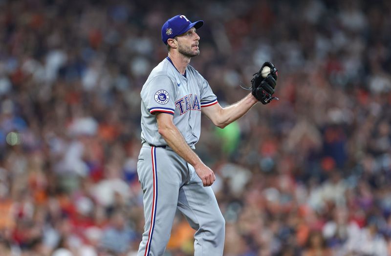 Jul 14, 2024; Houston, Texas, USA; Texas Rangers starting pitcher Max Scherzer (31) reacts after walking a batter during the fifth inning against the Houston Astros at Minute Maid Park. Mandatory Credit: Troy Taormina-USA TODAY Sports