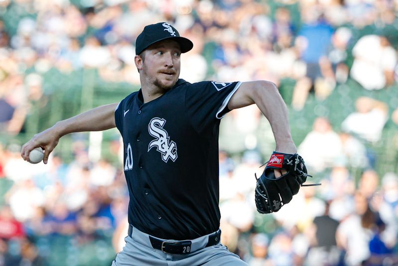 Jun 5, 2024; Chicago, Illinois, USA; Chicago White Sox starting pitcher Erick Fedde (20) delivers a pitch against the Chicago Cubs during the first inning at Wrigley Field. Mandatory Credit: Kamil Krzaczynski-USA TODAY Sports