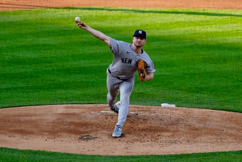 May 23, 2025; Denver, Colorado, USA; New York Yankees starting pitcher Clarke Schmidt (36) delivers a pitch in the first inning against the Colorado Rockies at Coors Field. Mandatory Credit: Ron Chenoy-Imagn Images