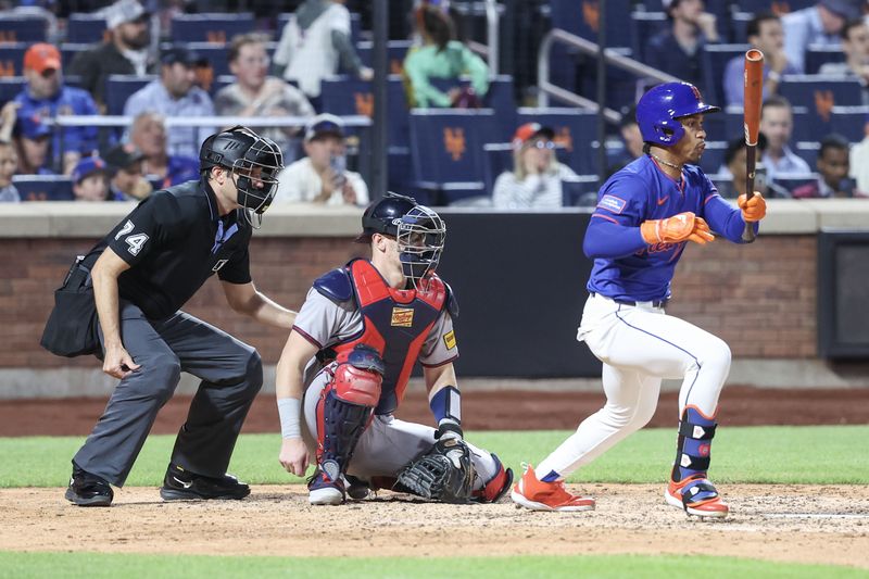 Jun 26, 2025; New York City, New York, USA;  New York Mets shortstop Francisco Lindor (12) hits a single in the fifth inning against the Atlanta Braves at Citi Field. Mandatory Credit: Wendell Cruz-Imagn Images