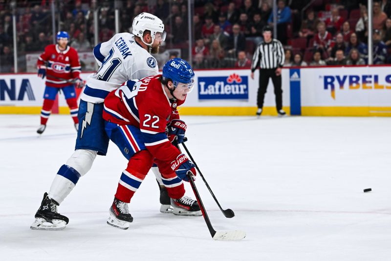 Apr 4, 2024; Montreal, Quebec, CAN; Tampa Bay Lightning defenseman Erik Cernak (81) defends against Montreal Canadiens right wing Cole Caufield (22) during the third period at Bell Centre. Mandatory Credit: David Kirouac-USA TODAY Sports