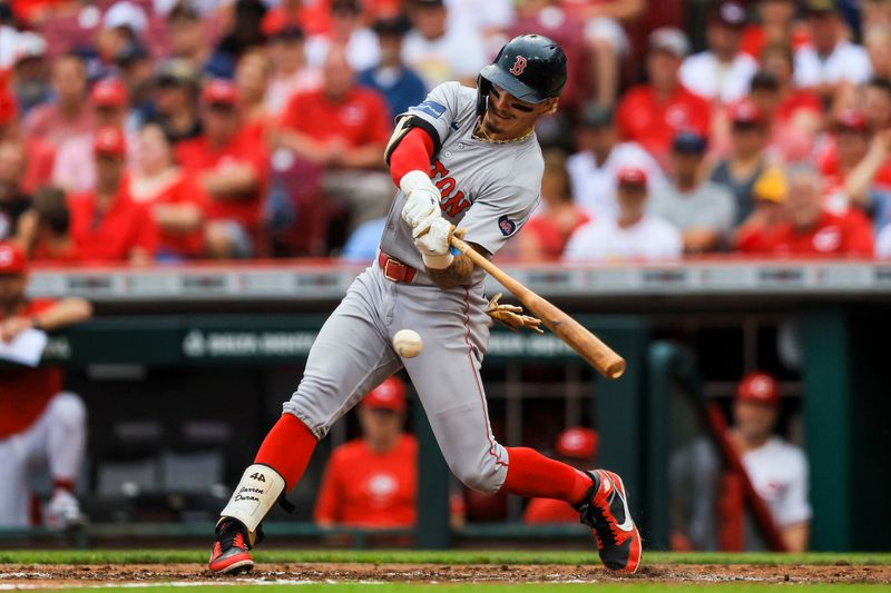 Jun 23, 2024; Cincinnati, Ohio, USA; Boston Red Sox outfielder Jarren Duran (16) hits a single against the Cincinnati Reds in the third inning at Great American Ball Park. Mandatory Credit: Katie Stratman-USA TODAY Sports