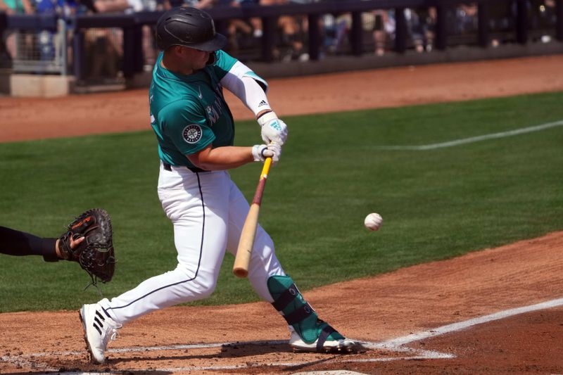 Mar 14, 2024; Peoria, Arizona, USA; Seattle Mariners first baseman Ty France (23) bats against the Milwaukee Brewers during the first inning at Peoria Sports Complex. Mandatory Credit: Joe Camporeale-USA TODAY Sports