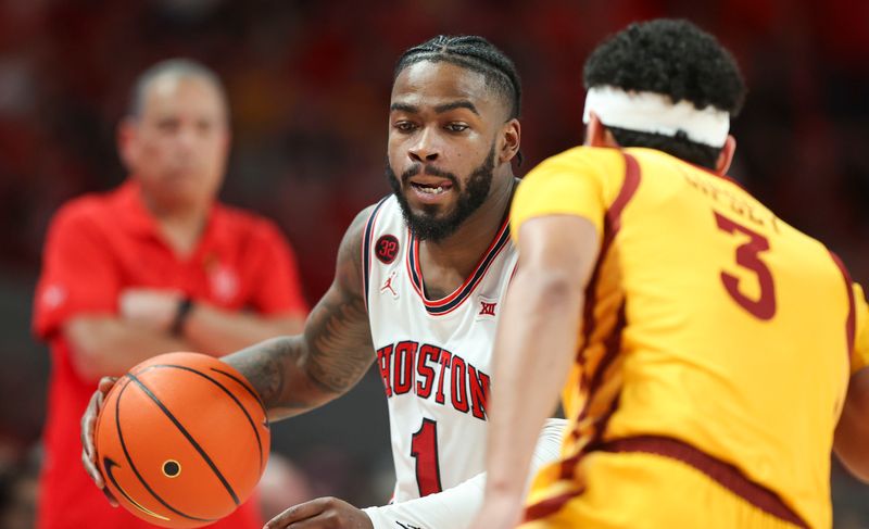 Feb 19, 2024; Houston, Texas, USA; Houston Cougars guard Jamal Shead (1) dribbles the ball as Iowa State Cyclones guard Tamin Lipsey (3) defends during the second half at Fertitta Center. Mandatory Credit: Troy Taormina-USA TODAY Sports