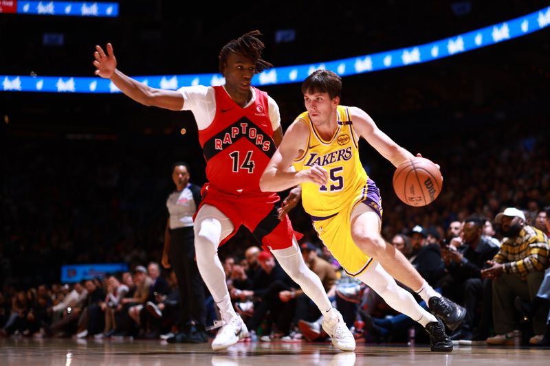 TORONTO, CANADA - NOVEMBER 1: Austin Reaves #15 of the Los Angeles Lakers drives to the basket during the game against the Toronto Raptors on November 1, 2024 at the Scotiabank Arena in Toronto, Ontario, Canada.  NOTE TO USER: User expressly acknowledges and agrees that, by downloading and or using this Photograph, user is consenting to the terms and conditions of the Getty Images License Agreement.  Mandatory Copyright Notice: Copyright 2024 NBAE (Photo by Vaughn Ridley/NBAE via Getty Images)