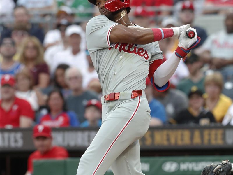 Jul 20, 2024; Pittsburgh, Pennsylvania, USA;  Philadelphia Phillies center fielder Johan Rojas (18) hits a single against the Pittsburgh Pirates during the fifth inning at PNC Park. Mandatory Credit: Charles LeClaire-USA TODAY Sports