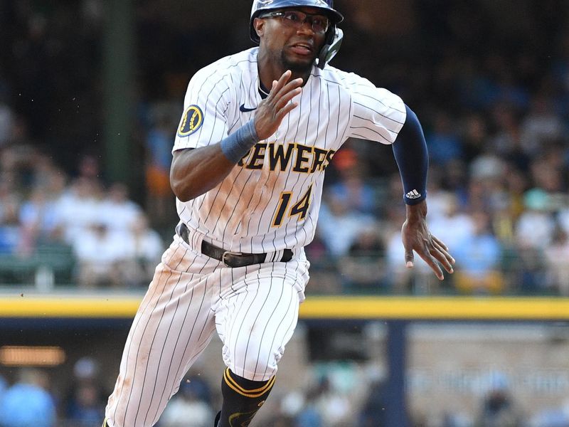 Aug 27, 2023; Milwaukee, Wisconsin, USA; Milwaukee Brewers second baseman Andruw Monasterio (14) runs safely to third base against the San Diego Padres in the seventh inning at American Family Field. Mandatory Credit: Michael McLoone-USA TODAY Sports