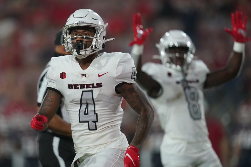 Sep 24, 2021; Fresno, California, USA; UNLV Rebels wide receiver Steve Jenkins (4) reacts after catching a touchdown against the Fresno State Bulldogs in the first quarter at Bulldog Stadium. Mandatory Credit: Cary Edmondson-USA TODAY Sports