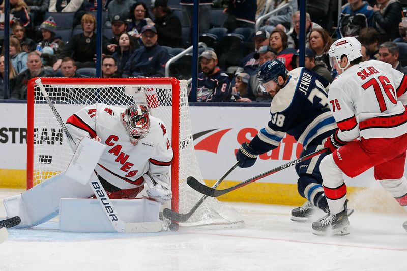 Feb 29, 2024; Columbus, Ohio, USA; Columbus Blue Jackets center Boone Jenner (38) reaches for the rebound of a Carolina Hurricanes goalie Spencer Martin (41) save during the third period at Nationwide Arena. Mandatory Credit: Russell LaBounty-USA TODAY Sports