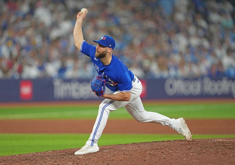 May 31, 2023; Toronto, Ontario, CAN; Toronto Blue Jays relief pitcher Anthony Bass (52) throws a pitch against the Milwaukee Brewers during the ninth inning at Rogers Centre. Mandatory Credit: Nick Turchiaro-USA TODAY Sports