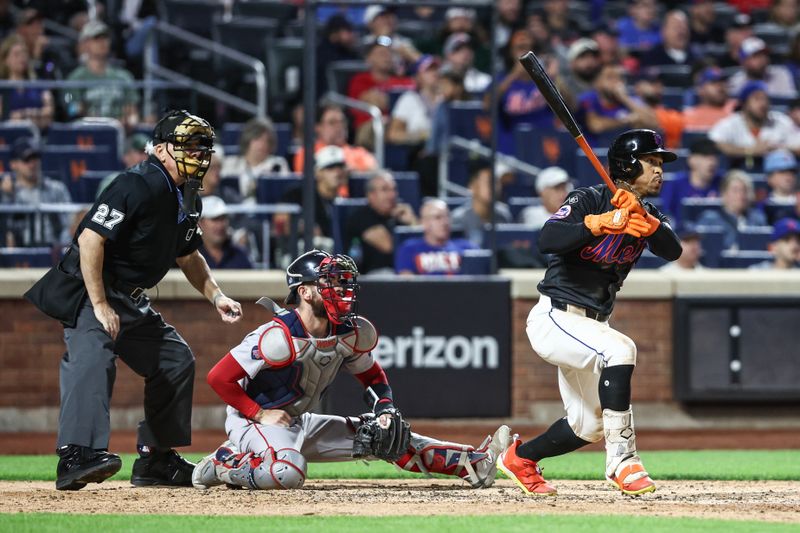 Sep 2, 2024; New York City, New York, USA;  New York Mets shortstop Francisco Lindor (12) hits a RBI single in the fourth inning against the Boston Red Sox at Citi Field. Mandatory Credit: Wendell Cruz-USA TODAY Sports