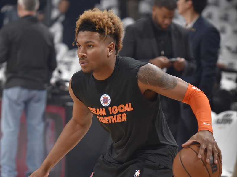 CLEVELAND, OH - APRIL 15: Miles McBride #2 of the New York Knicks warms up before the game against the Cleveland Cavaliers during the 2023 Round 1 Game 1 NBA Playoffs on April 15, 2023 at Rocket Mortgage FieldHouse in Cleveland, Ohio. NOTE TO USER: User expressly acknowledges and agrees that, by downloading and/or using this Photograph, user is consenting to the terms and conditions of the Getty Images License Agreement. Mandatory Copyright Notice: Copyright 2023 NBAE (Photo by David Liam Kyle/NBAE via Getty Images)