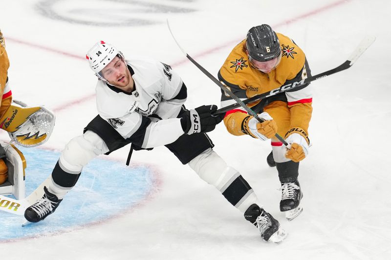 Feb 5, 2026; Las Vegas, Nevada, USA; Vegas Golden Knights defenseman Kaedan Korczak (6) hooks the stick of Los Angeles Kings right wing Alex Laferriere (14) during the third period at T-Mobile Arena. Mandatory Credit: Stephen R. Sylvanie-Imagn Images
